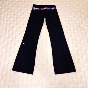 Lululemon Flare Black Stretch pants with Multi-Color Waistband, Size 6 Reg.